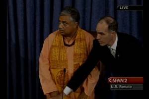 Rajan Zed waits as protesters interrupt the invocation. Photo courtesy of C-Span 2.