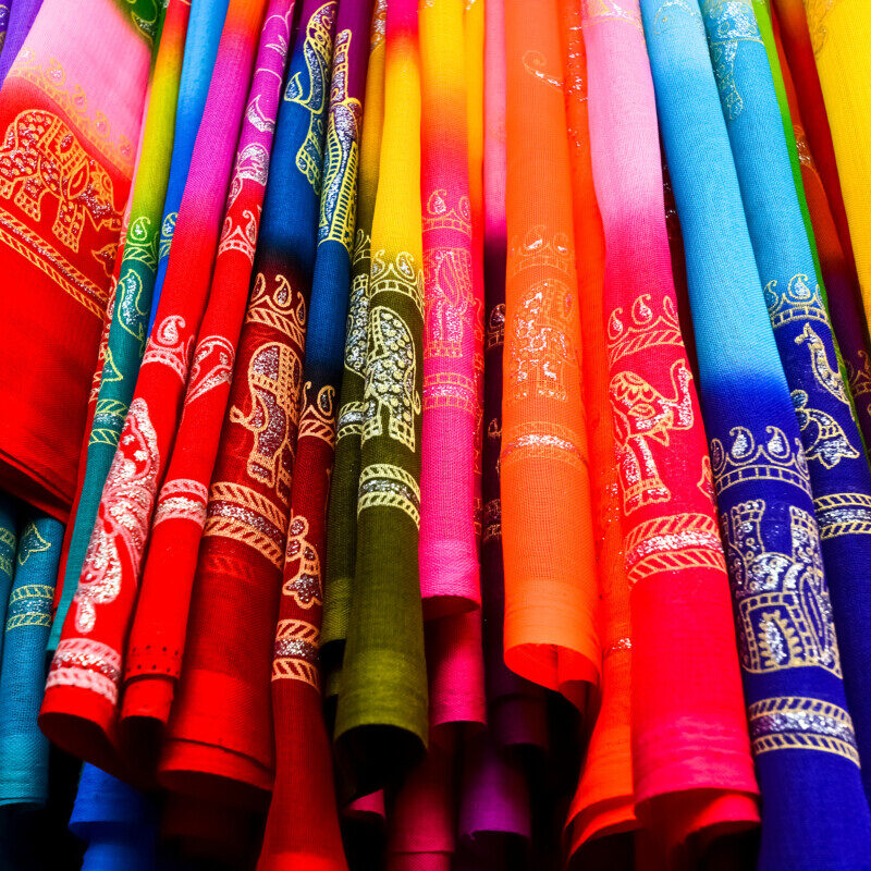 colorful saris displayed in a linear fashion