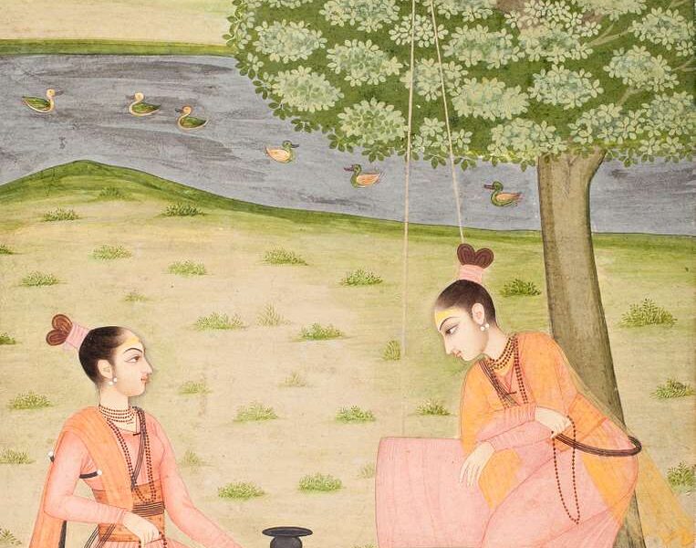 An 18th-century painting of two female ascetics in saffron robes by a river. One sits cross-legged on a black deerskin under a tree, while the other stands beside a rope swing. Ducks float on the river against gentle hills in the background.