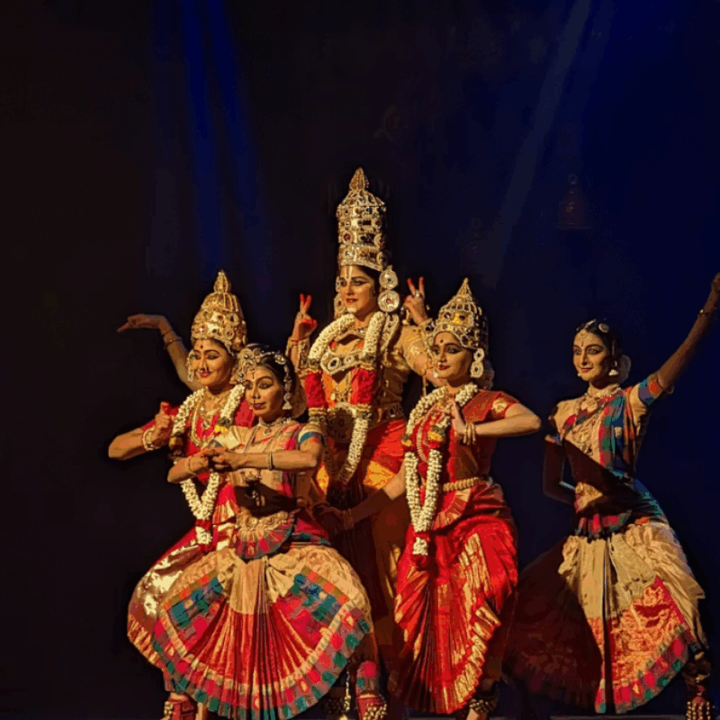 Five South Indian dancers in colorful costumes, depicting Maha Vishnu and his divine consorts.